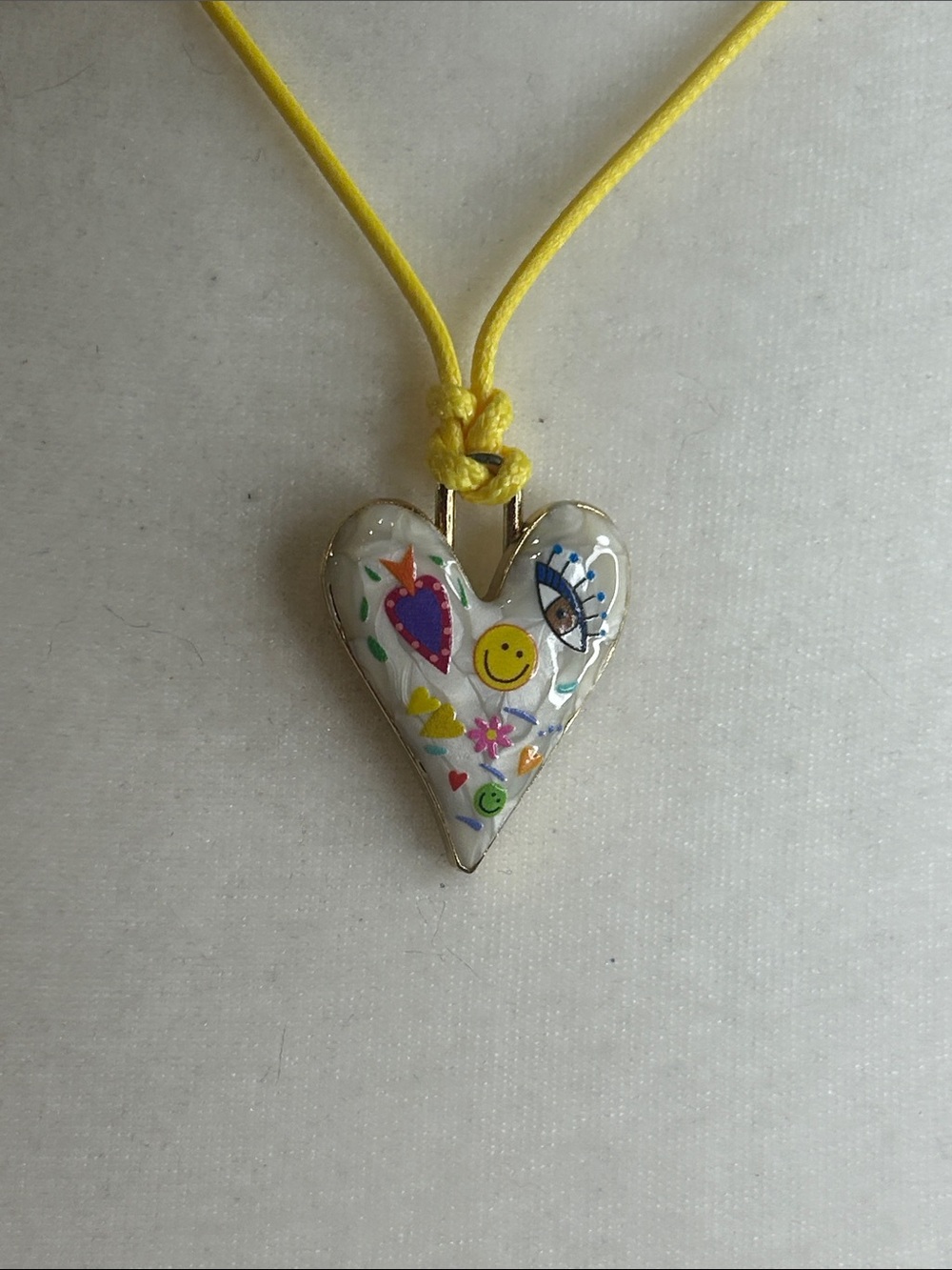White Enamel Doodle Heart 1.25” On Yellow 18” Dia Cord Hand Painted New